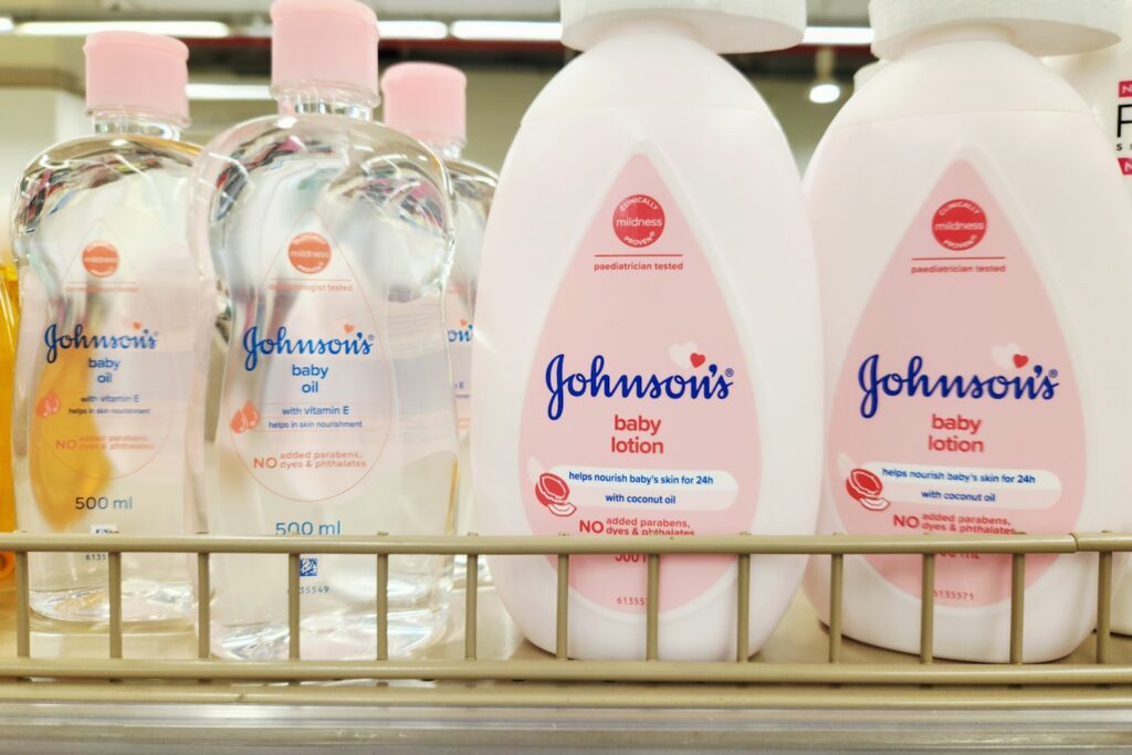 The image shows Johnson’s Baby Oil and Baby Lotion, essential products in baby skincare routines. The baby oil is designed to lock in moisture and keep skin soft, while the lotion provides gentle hydration for delicate skin. Both products are dermatologically tested, hypoallergenic, and safe for daily use. With mild fragrances and clinically proven formulas, they are trusted by parents worldwide. The packaging reflects Johnson’s iconic baby-friendly branding and is a staple in nurseries and baby care kits.