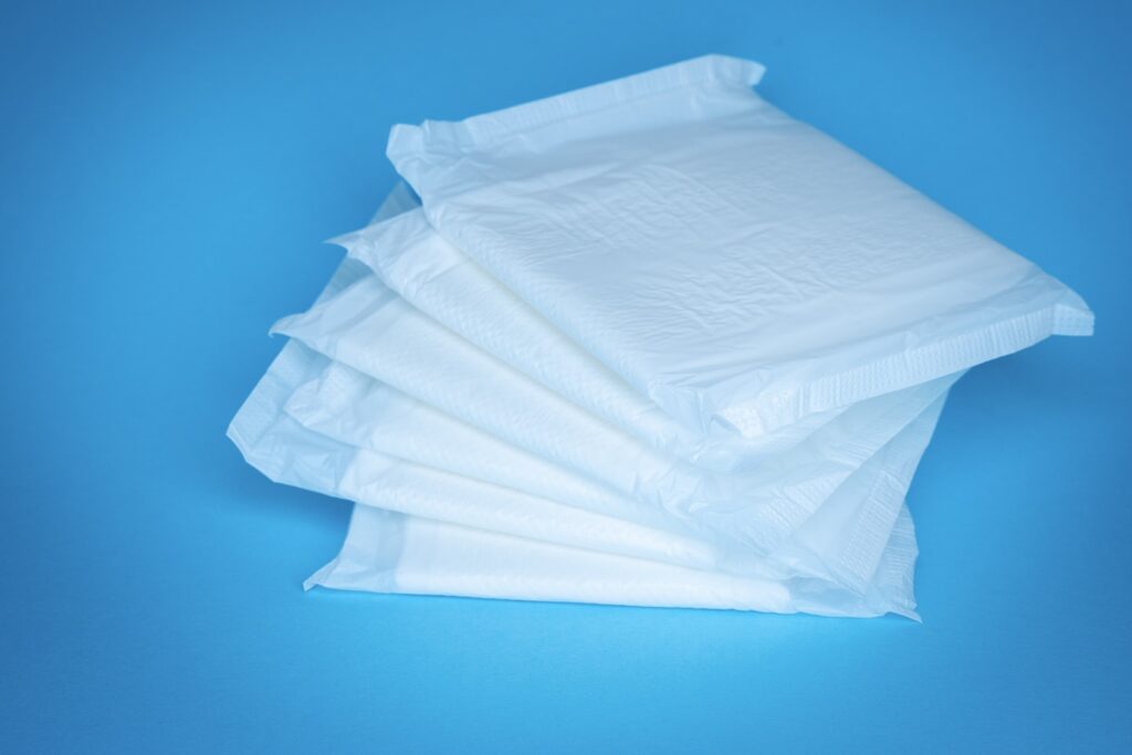 a pile of white tissue sitting on top of a blue table