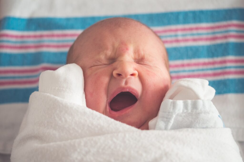 My newest daughter, we have 4, was just about a day old when I caught this cute image of her yawning. Being born is apparently hard work!