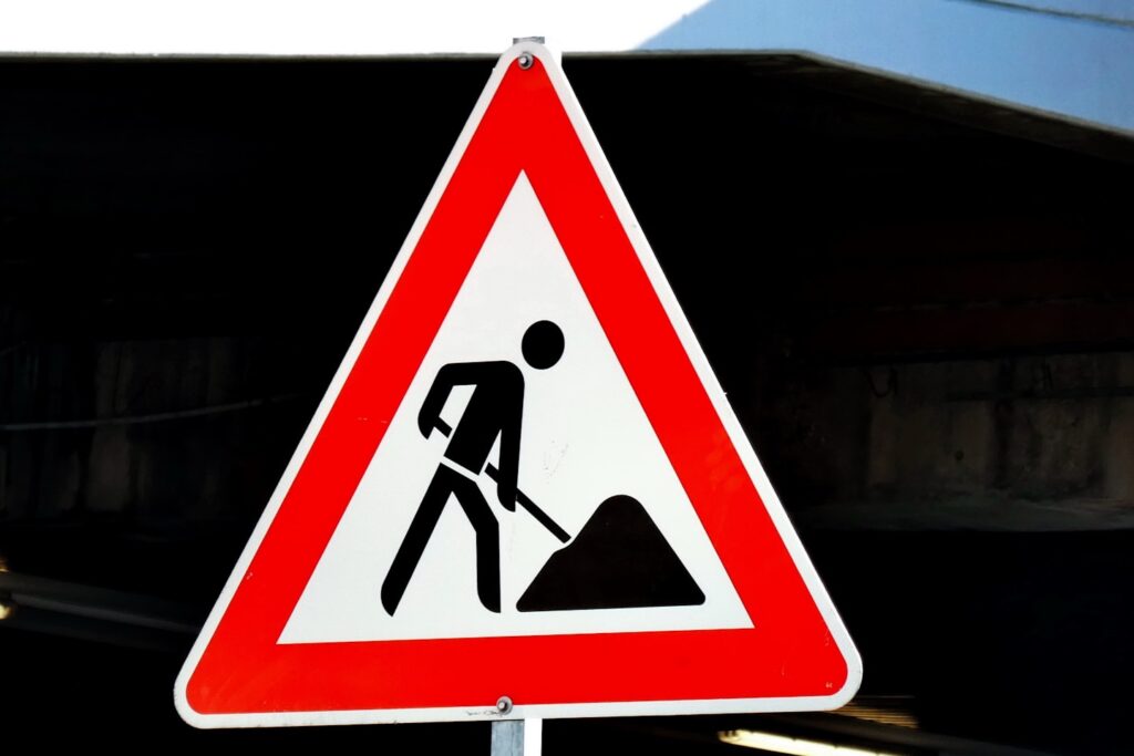Road sign: construction ahead. For whatever is under construction or work in progress :-)
